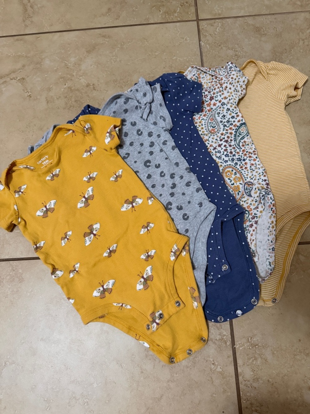 Carter’s 
Includes five short-sleeve baby bodysuits for easy outfit rotation